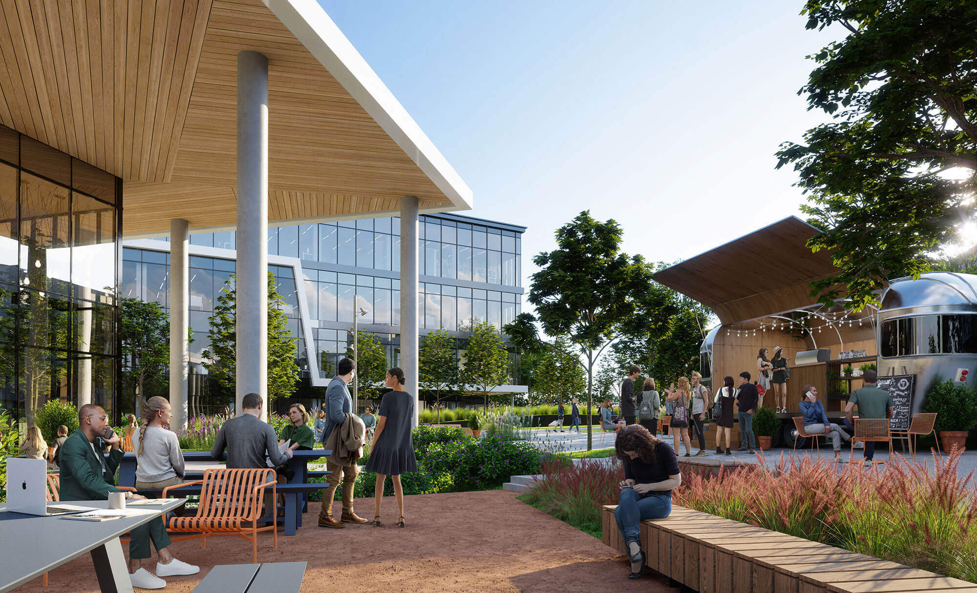 People enjoying outdoor seating and food truck area at Highpoint office campus