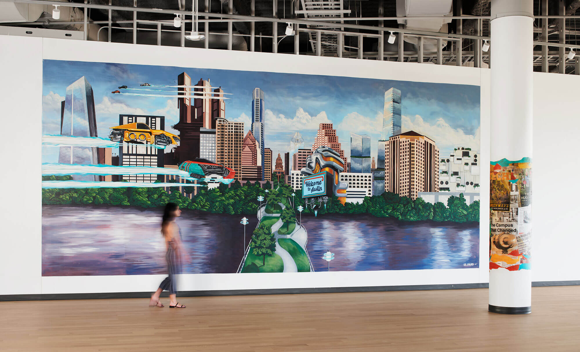 Large mural depicting futuristic Austin skyline inside Highpoint office building