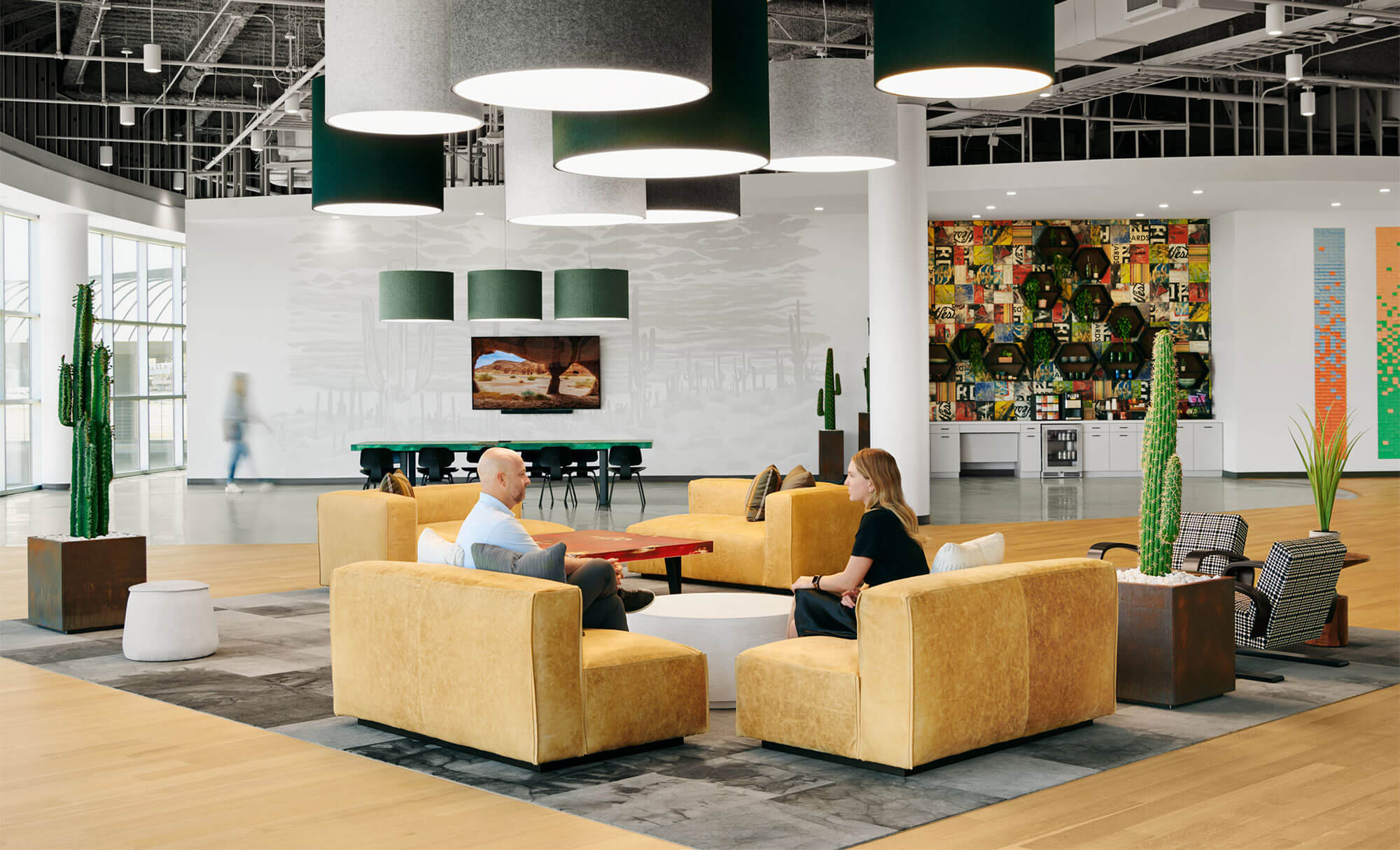 Spacious lobby at Highpoint with modern furniture and artistic wall installations, emphasizing collaboration