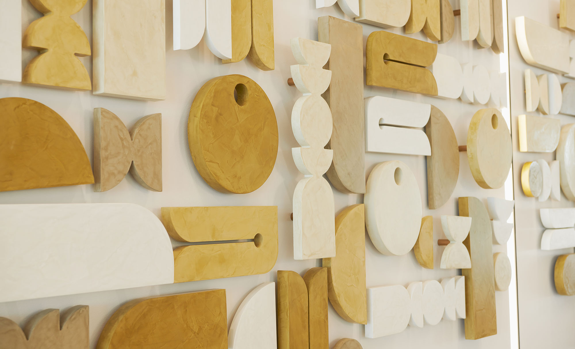 Wood elements wall composition in Karlin Real Estate offices lobby