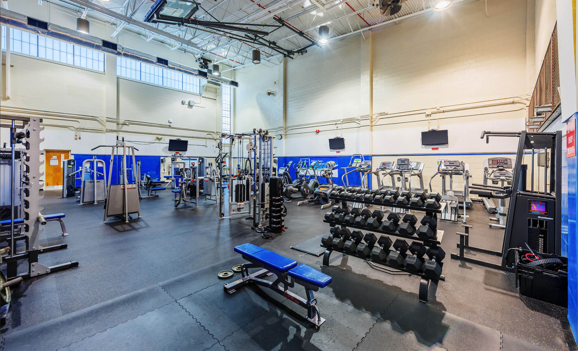 State-of-the-art gym at Parmer RTP offering a variety of fitness machines and weights