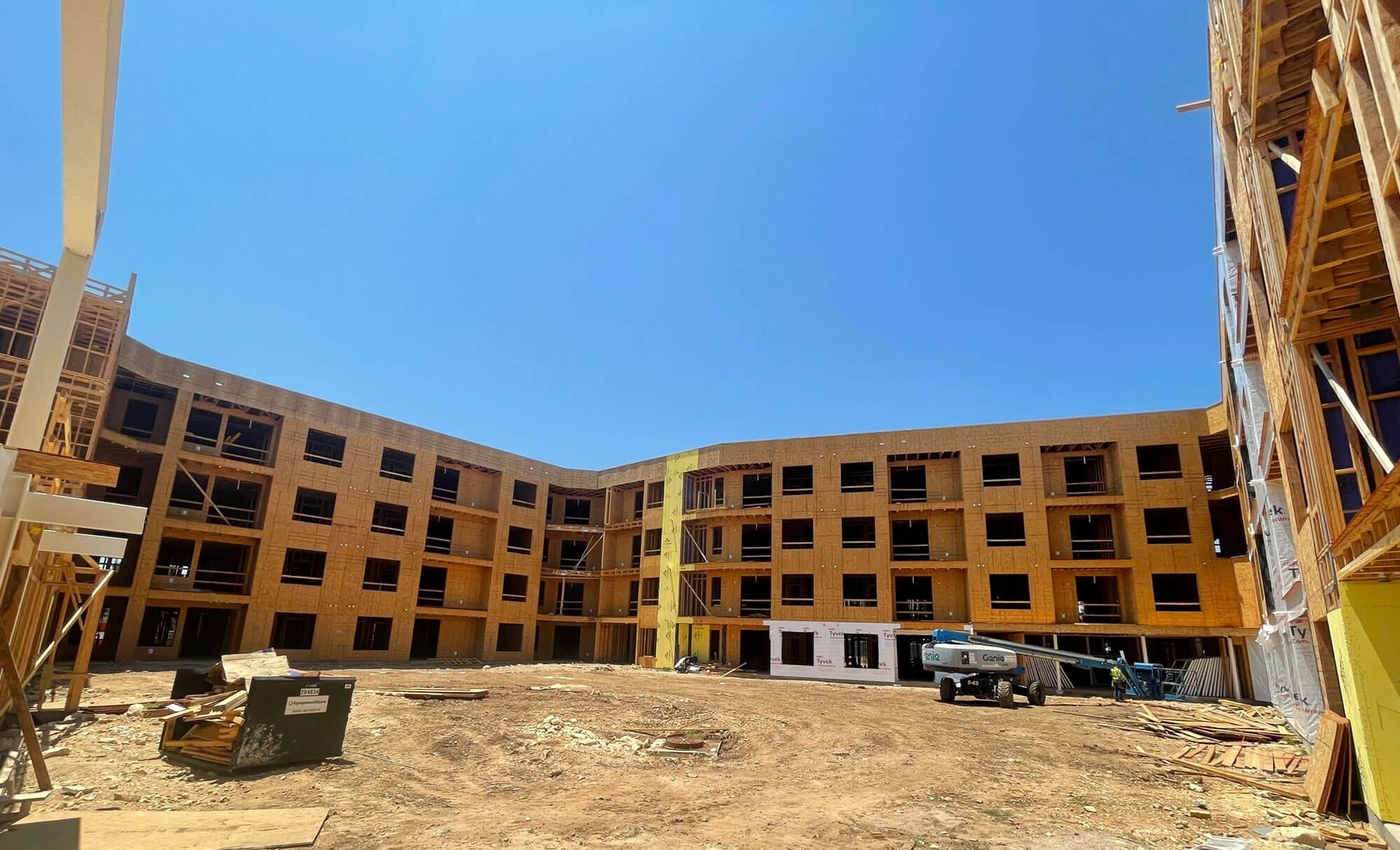 Courtyard perspective of under-construction apartment complex in Austin’s Research Park