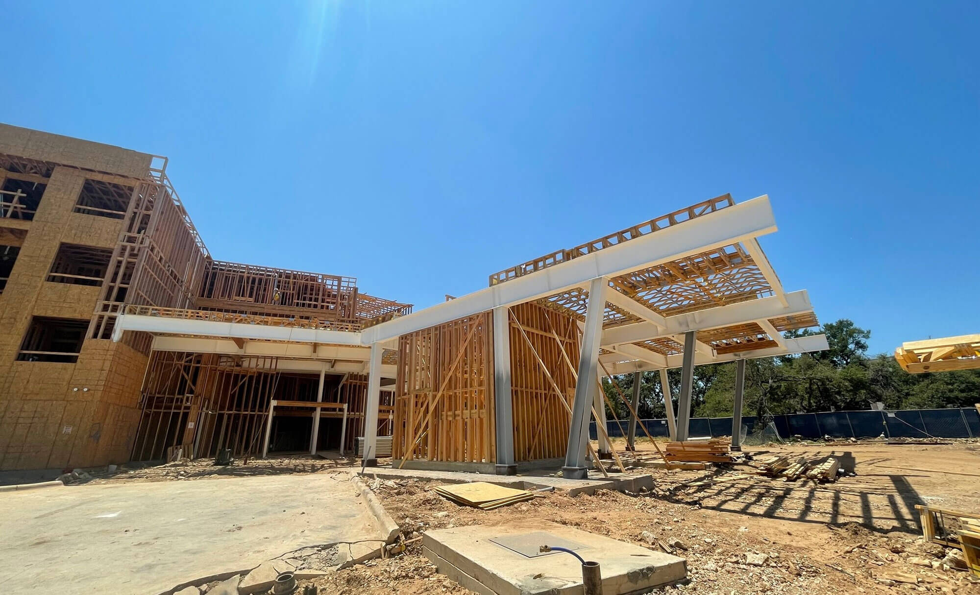 Entrance area of The Edition under construction, highlighting wooden frameworks and support structures